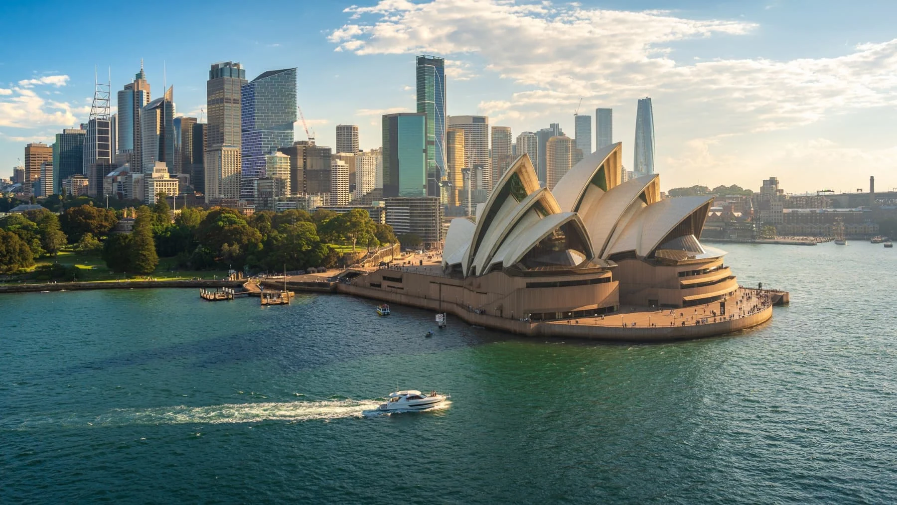 cityscape of sydney australia - a famous opera house is visible on the water