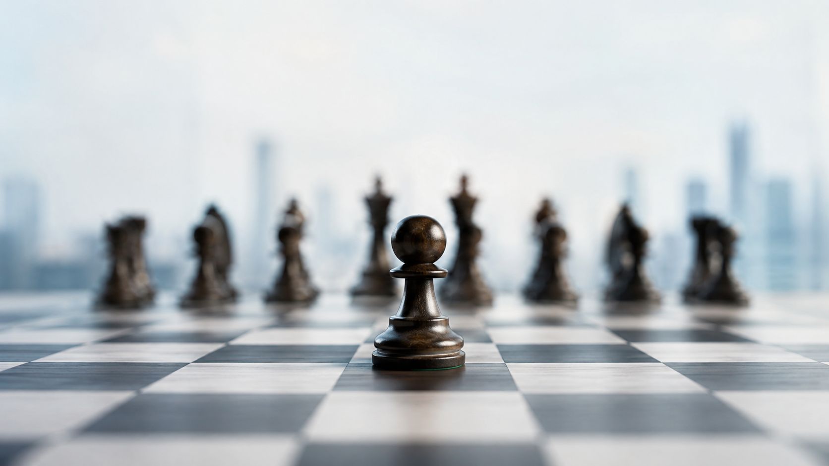 A lone black chess pawn stands in the foreground on a wooden chessboard with blurry chess pieces behind.